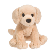 A cream dog plush sitting down.