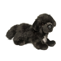 A fluffy black dog plush.